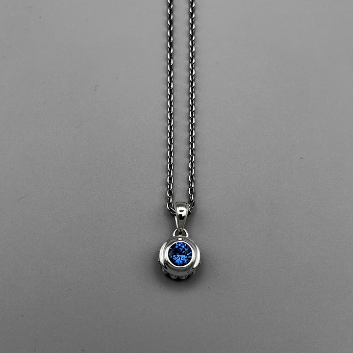 TRIPLE X STUDS SOLITAIRE BIRTHDAY 5mm STONE PENDANT / XP-214SAG